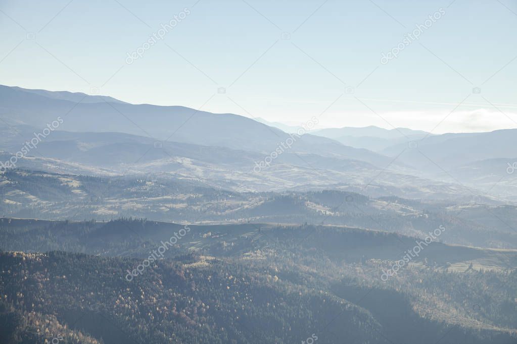 hazy mountains landscape under blue sky, Carpathians, Ukraine