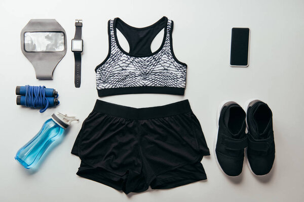 view from above of arranged set of sport equipment isolated on white