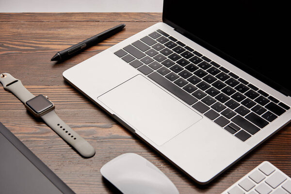 close-up shot of graphic designer gadgets on wooden table