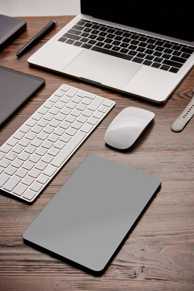 close-up shot of various wireless gadgets on graphics designer workplace