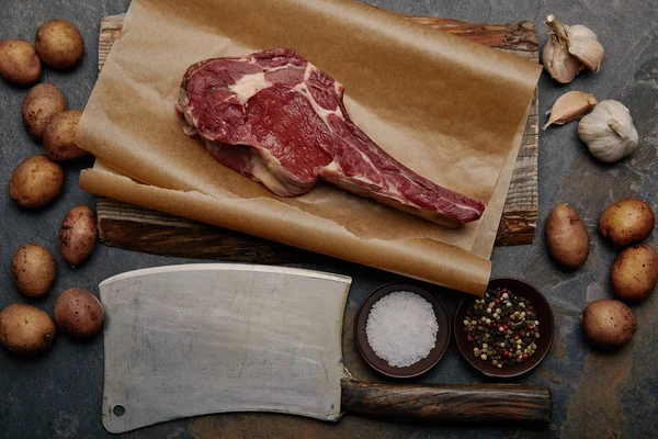 Flat Lay Raw Rib Eye Steak Baking Paper Butcher Knife — Stock Photo, Image