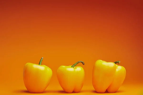 Close View Fresh Ripe Bell Peppers Orange Background — Stock Photo, Image