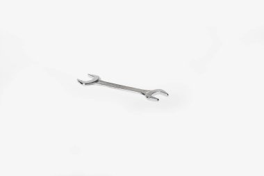 Silver colored wrench tool isolated on white clipart