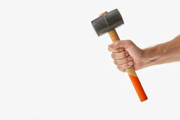 Partial view of man holding mallet isolated on white