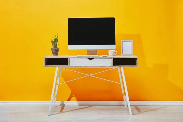 Computer Photo Frame Cup Coffee Cactus Workplace Yellow Wall — Stock Photo, Image