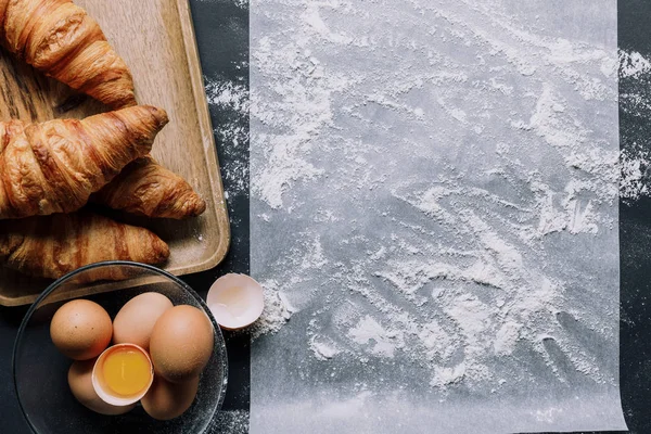 Flat Lay Flour Baking Paper Croissants Eggs Bowl Black Table — Stock Photo, Image