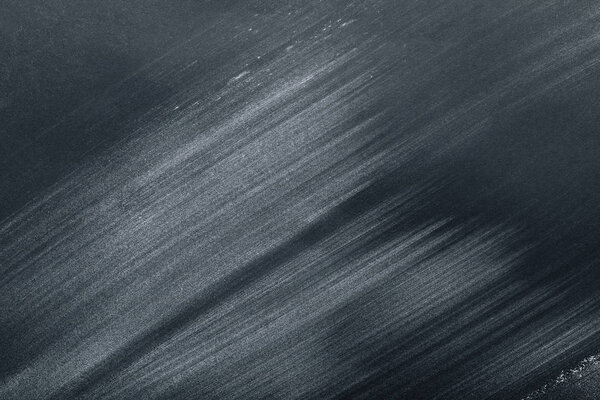 full frame image of black table with flour strokes 