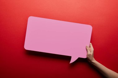 top view of empty speech bubble in pink color on red background clipart