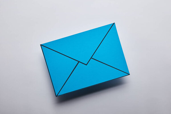 top view of blue email sign on grey background
