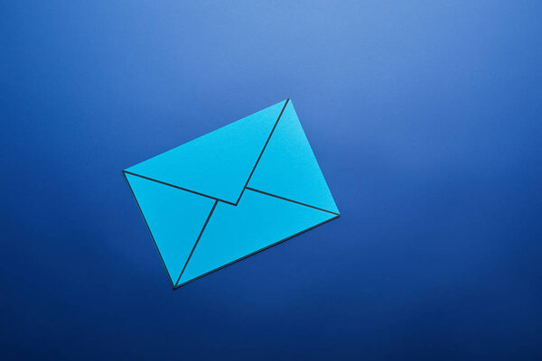 top view of light blue email sign on blue background