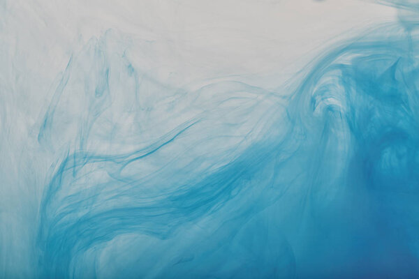 абстрактный фон с голубыми вихрями краски
