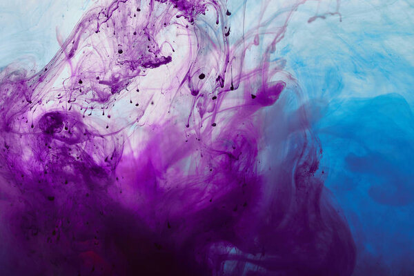 abstract background with purple and blue mixing paint swirls