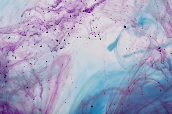 abstract texture with purple and blue mixing swirls of paint