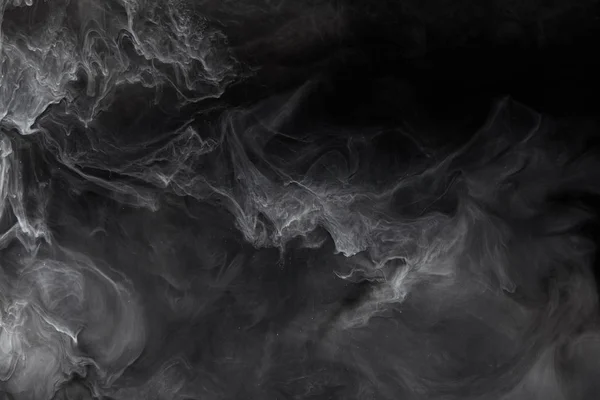 abstract splash of grey paint on black background