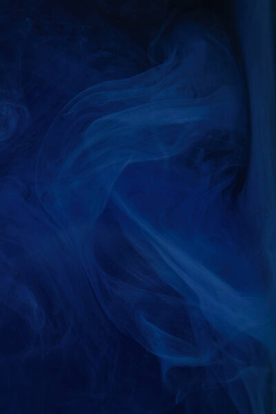 abstract dark texture with blue swirls of paint