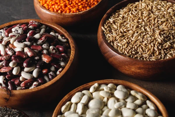 Variety Beans Wooden Bowls Oat Groats Table — Free Stock Photo