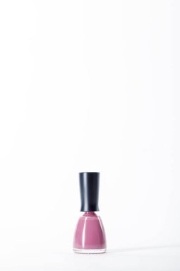 bottle of shiny pink nail polish on white clipart