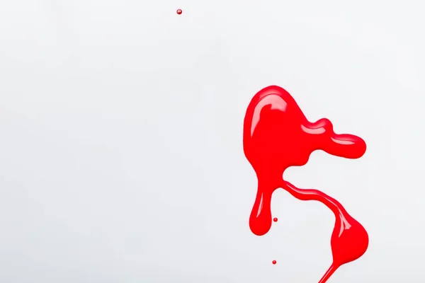 Vista Superior Derramamento Abstracr Vermelho Esmalte Isolado Cinza — Fotografia de Stock