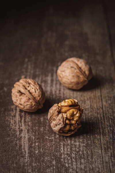 close up view of natural walnuts on wooden tabletop