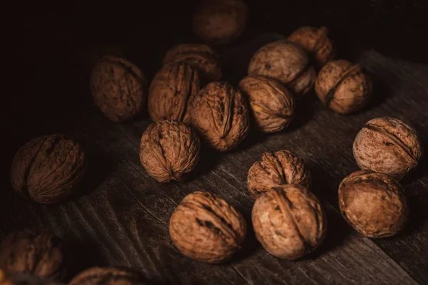 Close View Walnuts Husk Wooden Table — Free Stock Photo