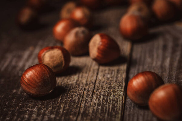 close up view of shelled hazelnuts on wooden tabletop