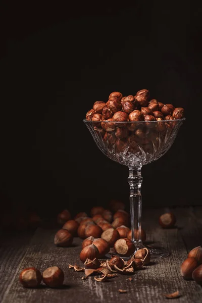 Close View Shelled Hazelnuts Glassware Wooden Surface Black Background — Free Stock Photo