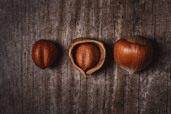 top view of hazelnuts on wooden surface