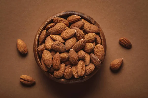 Top View Wooden Bowl Almonds Brown Background — Stock Photo, Image