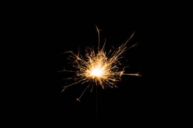 close-up view of festive new year sparkler on black background  clipart
