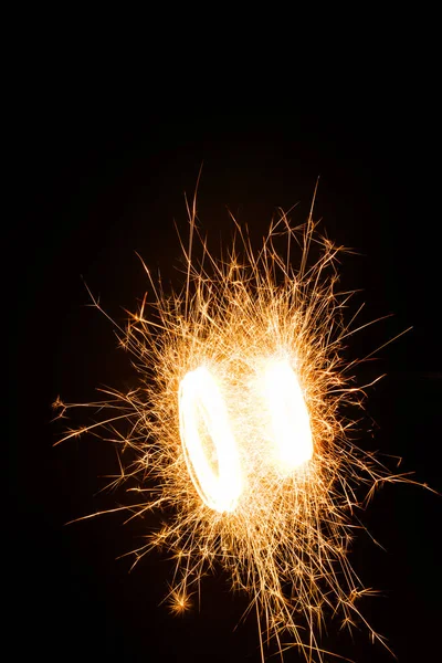 Bright Burning New Year Sparkler Black Background — Free Stock Photo