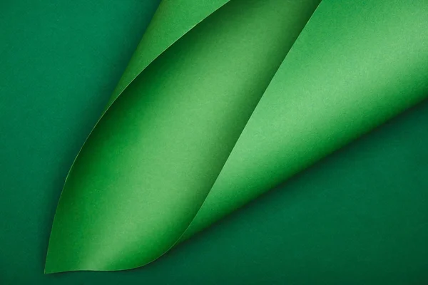 stock image elevated view of green paper on colored background