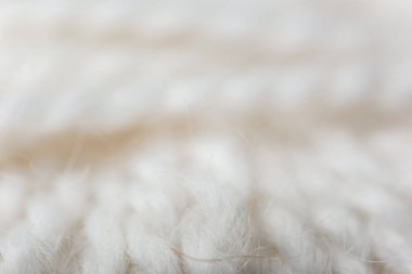 full frame of white knitting texture as backdrop clipart