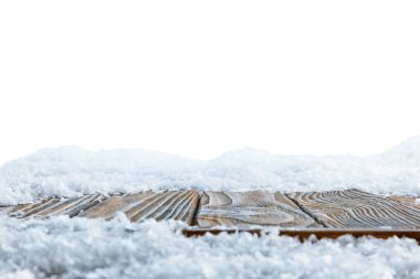 striped brown wooden board covered with snow on white clipart