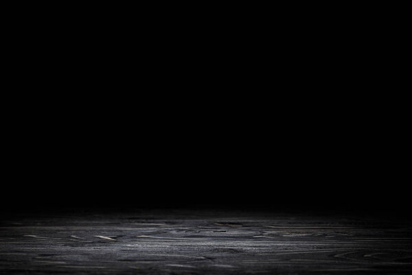 dark grey striped wooden tabletop on black