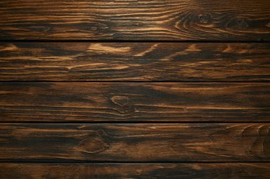 top view of dark brown wooden background with horizontal planks clipart