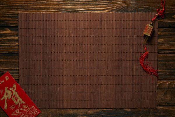 chinese new year background with traditional decorations and bamboo mat