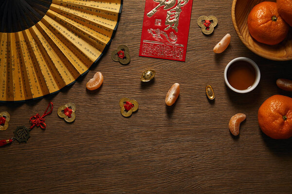 top view of chinese new year composition on wooden surface