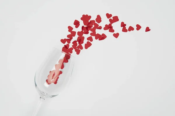 Top View Wine Glass Small Paper Cut Hearts White Background — Stock Photo, Image