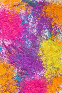 top view of explosion of multicolored holi powder on white background clipart