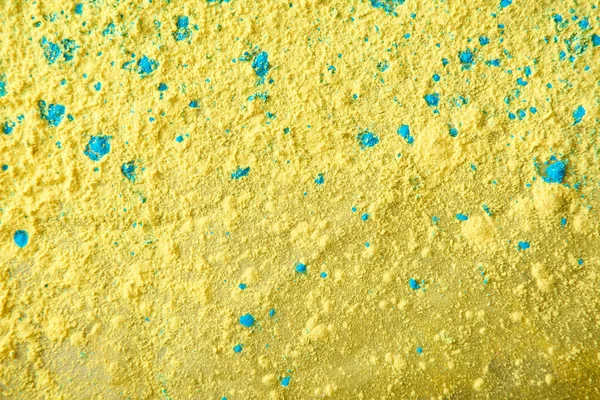 黄色と青のホーリー パウダーのクローズ アップ — ストック写真