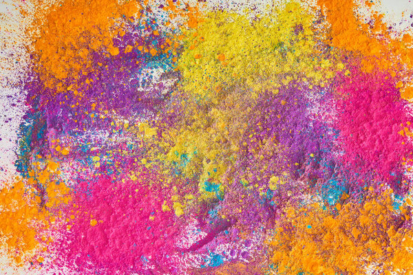 top view of explosion of multicolored holi powder