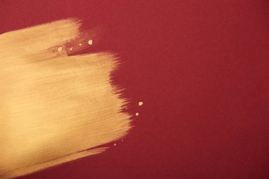 Altın brushstroke ve kopya alanı ile sanatsal Bordo duvar kağıdı