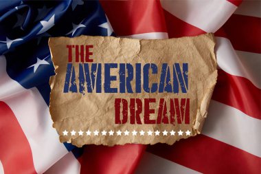 vintage crumpled paper with the american dream lettering on american flag 