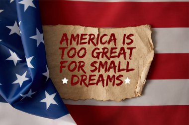 vintage crumpled paper with america is too great for small dreams quote on american flag  clipart