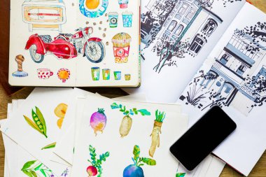 top view of watercolor drawings and smartphone clipart