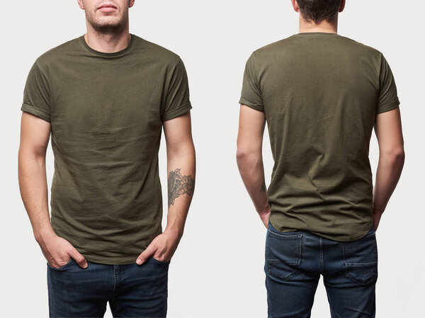 cropped view of tattooed man in basic khaki t-shirt with copy space isolated on white