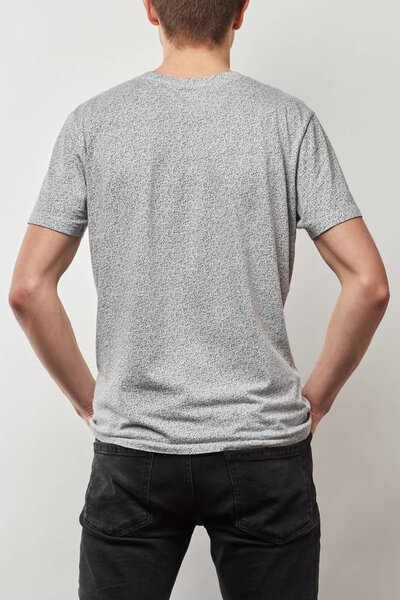 back view of man in cotton t-shirt with copy space isolated on grey