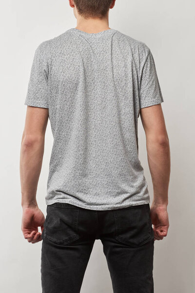 back view of man in cotton t-shirt with copy space isolated on grey