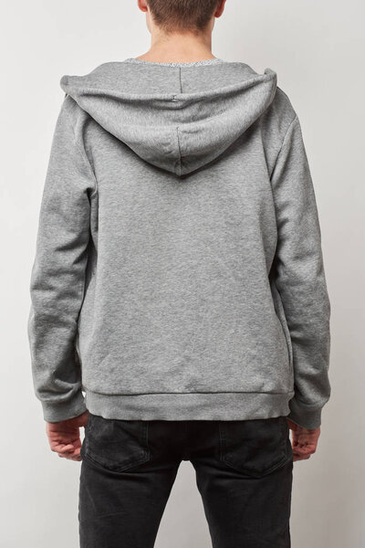 back view of man in grey hoodie with copy space isolated on white