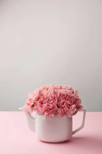 Close View White Kettle Beautiful Tender Pink Flowers Grey — Stock Photo, Image